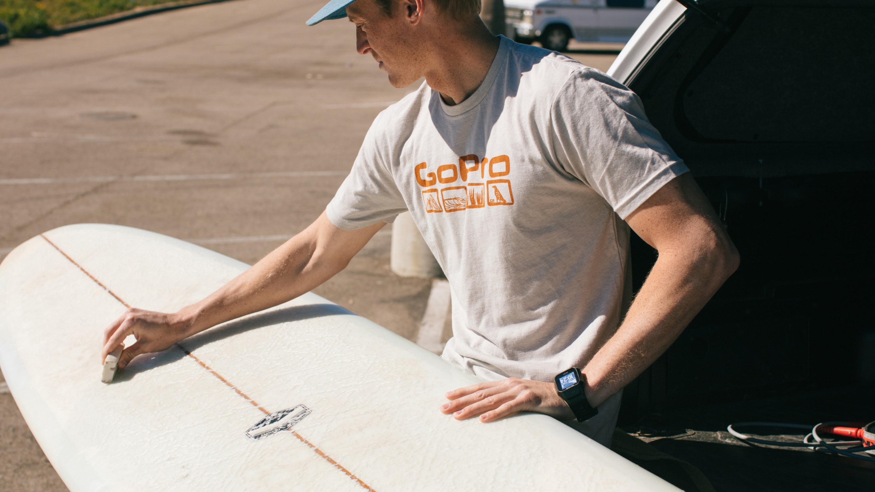 surfer wearing GoPro The Benchetler - Graphic Logo Tee