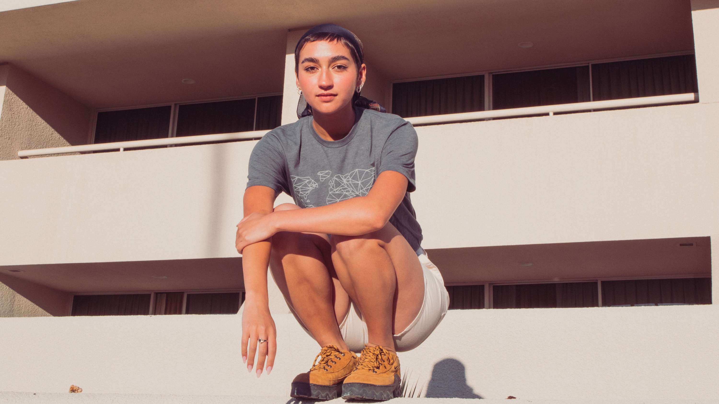 Person wearing GoPro Global Graphic Tee – Gray (Unisex T-Shirt)