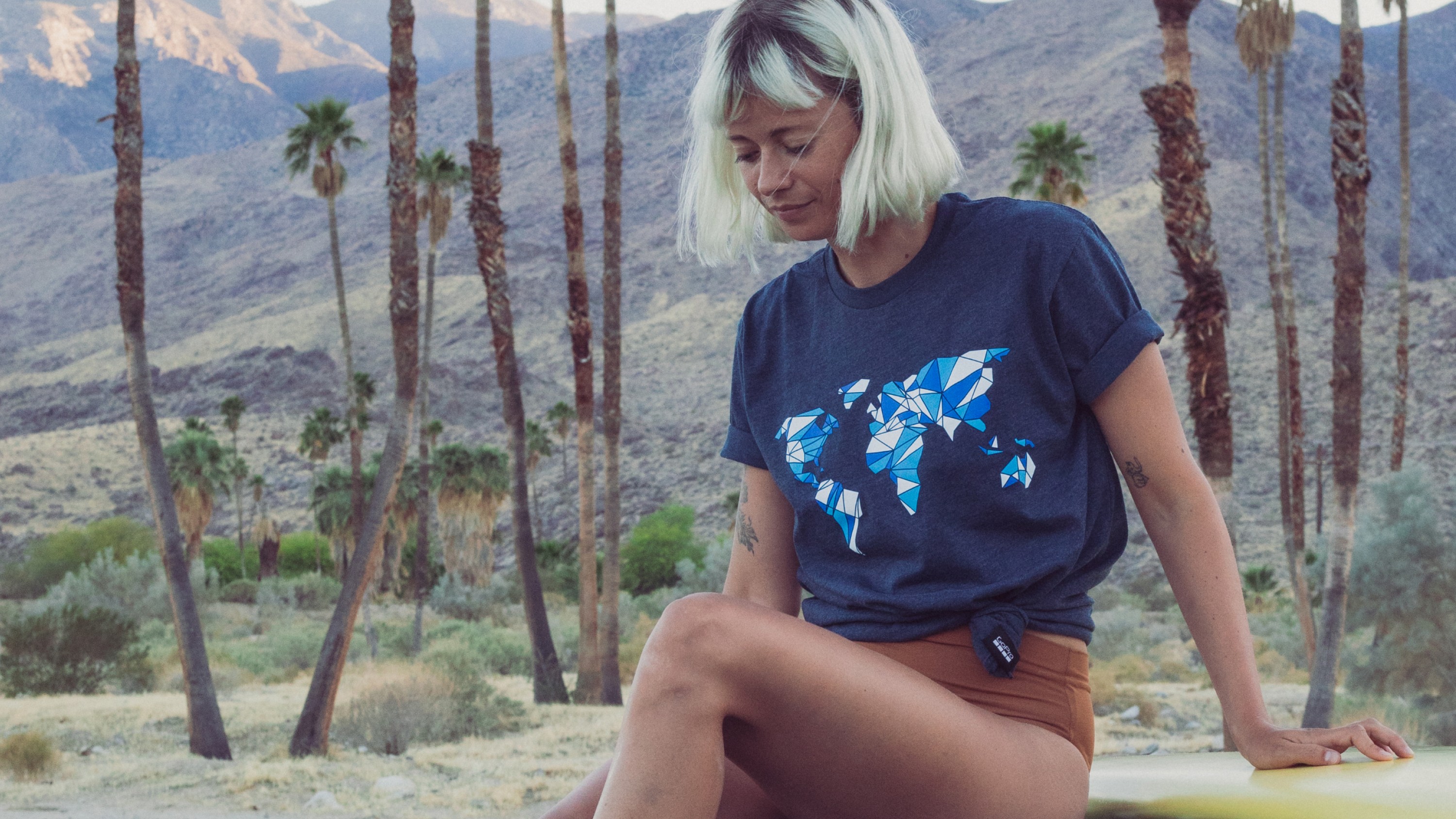 Girl wearing GoPro Global Graphic Tee – Blue (Unisex T-Shirt)