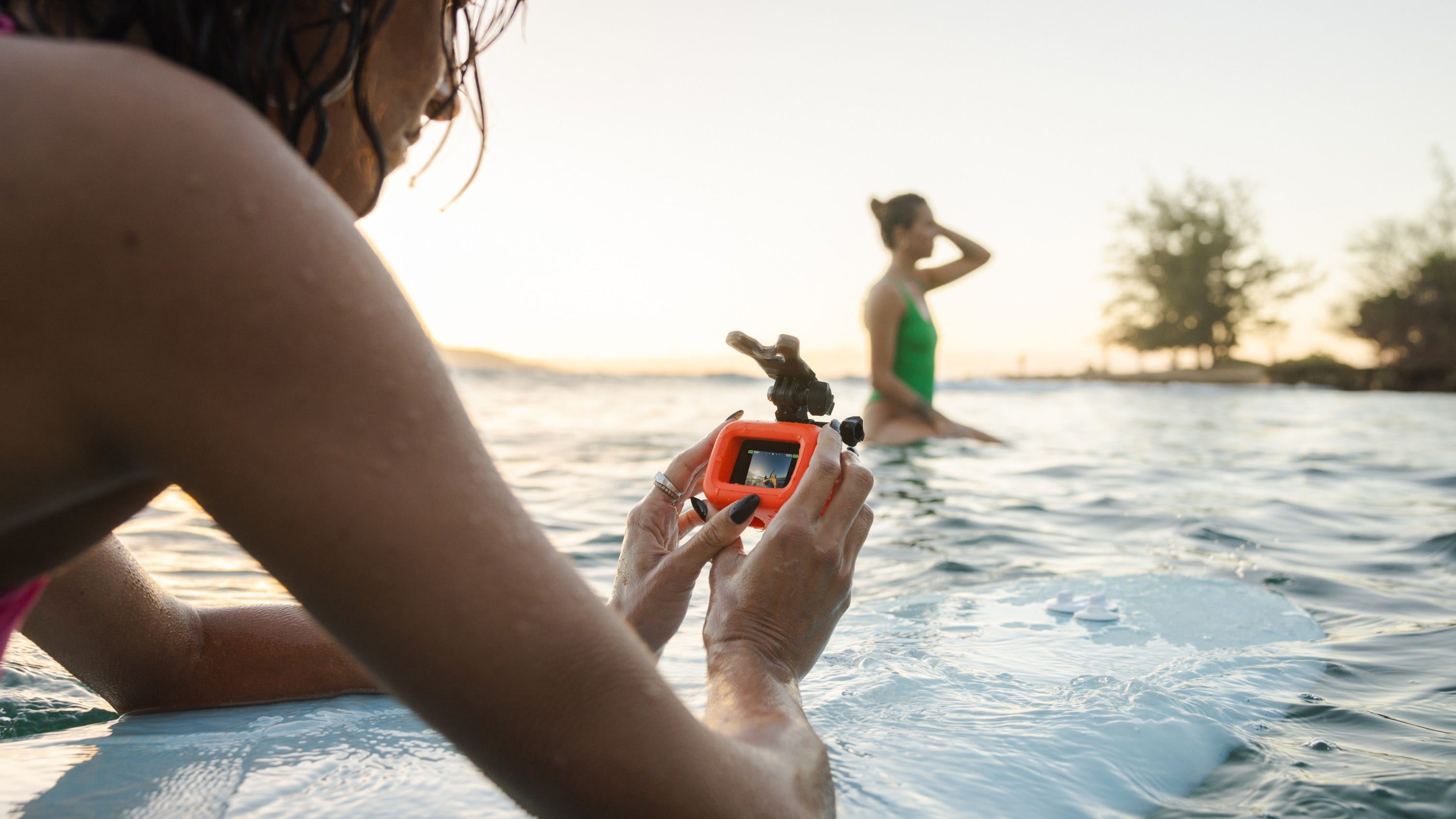 Surfers taking pictures using Floaty for HERO