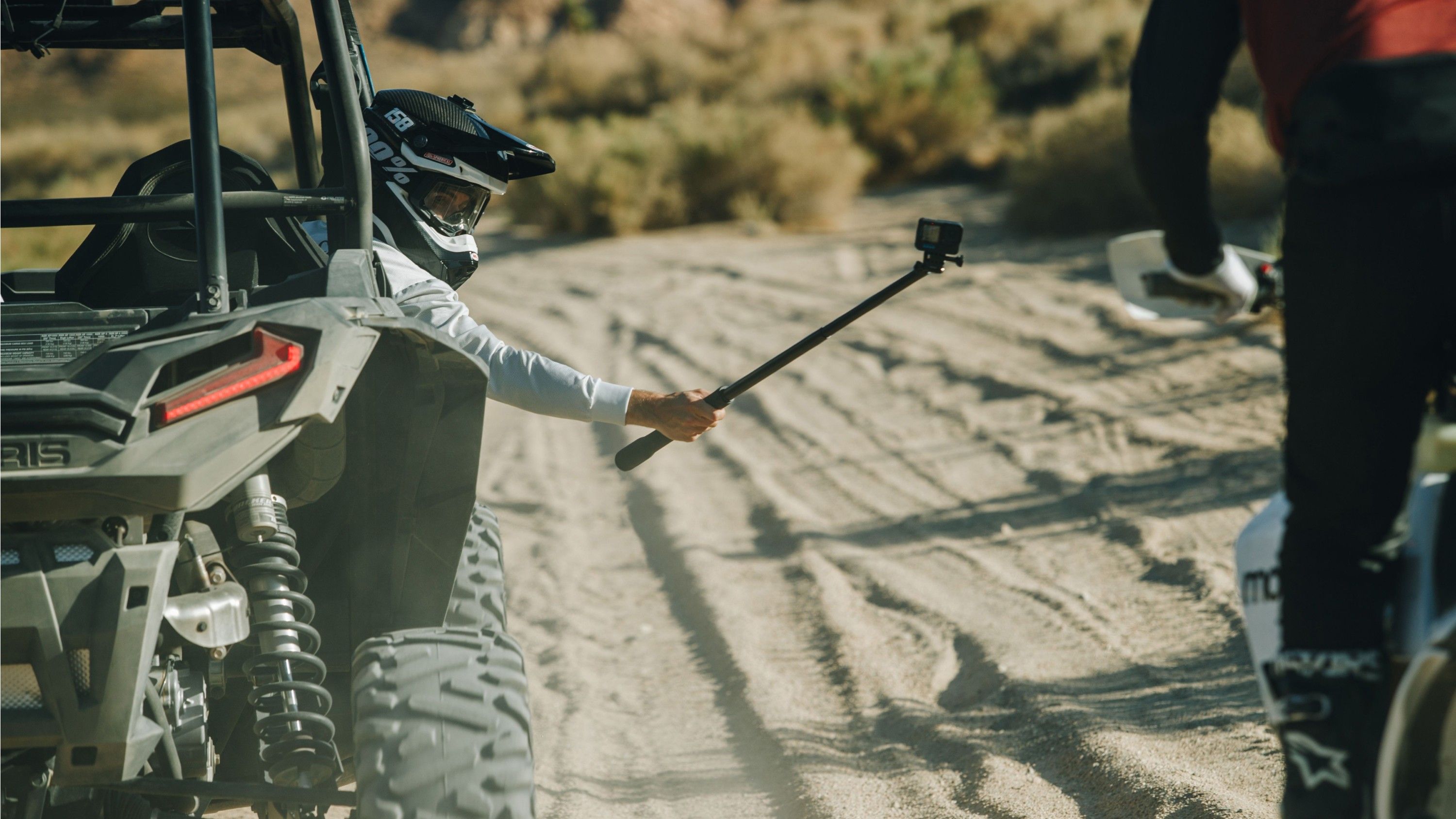 GoPro El Grande extended camera pole recording dirt biker from car