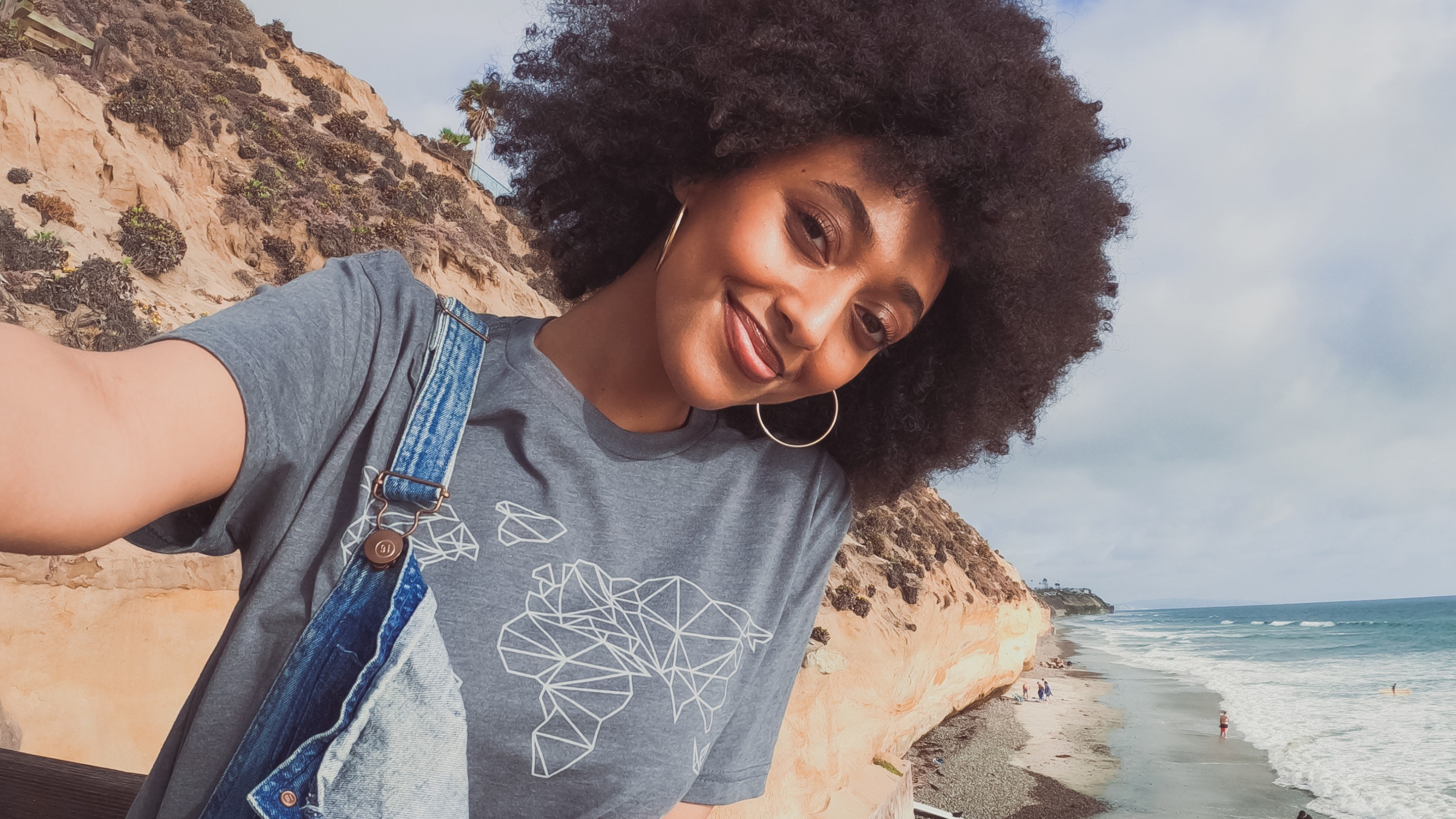 Woman wearing GoPro Global Graphic Tee – Gray (Unisex T-Shirt)