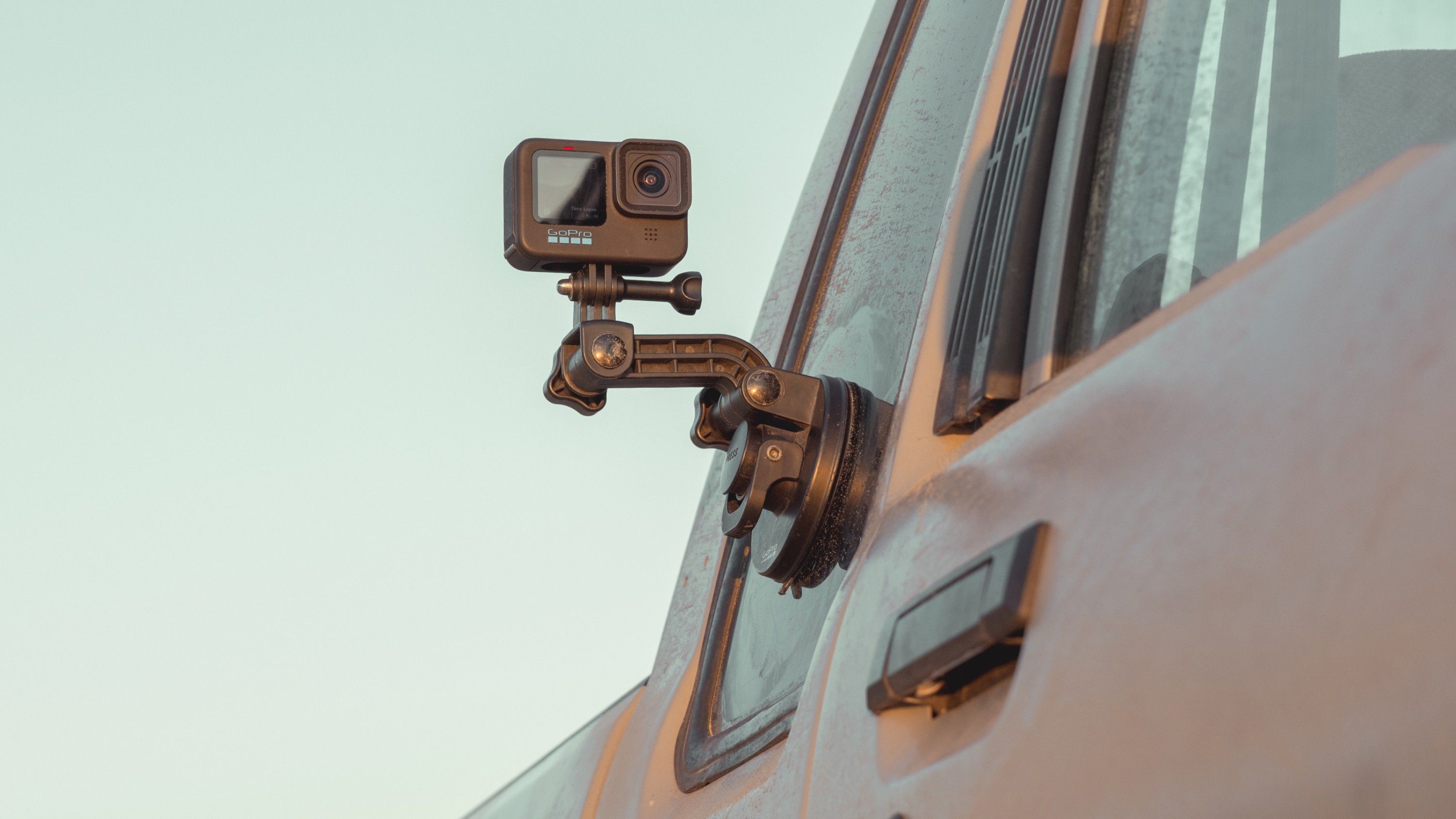 GoPro Suction Cup Camera Mount mounted to side window of truck