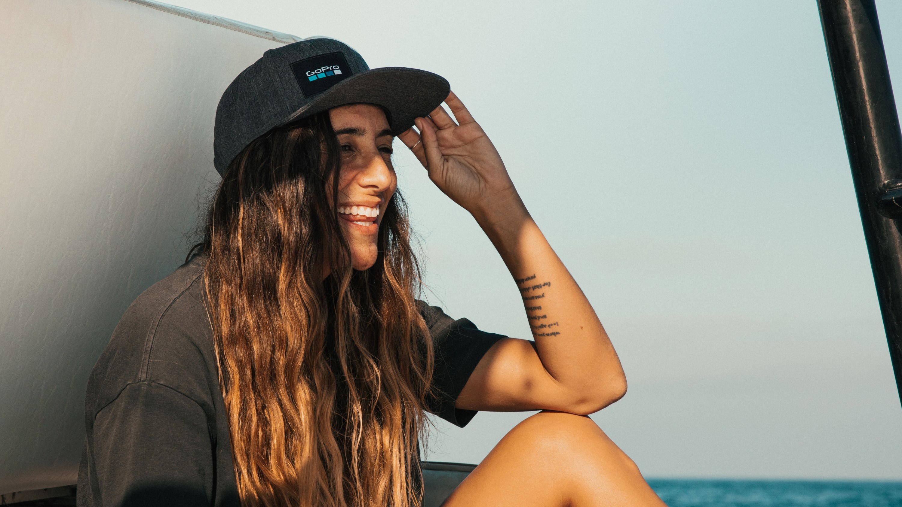 Woman wearing GoPro El Cap – Logo Snapback Hat