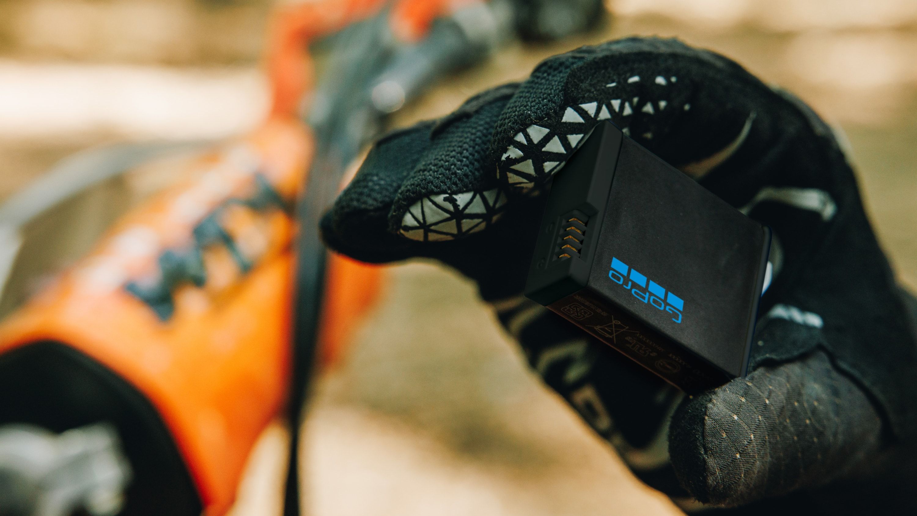 GoPro Enduro battery for HERO13 Black held near outdoor gear